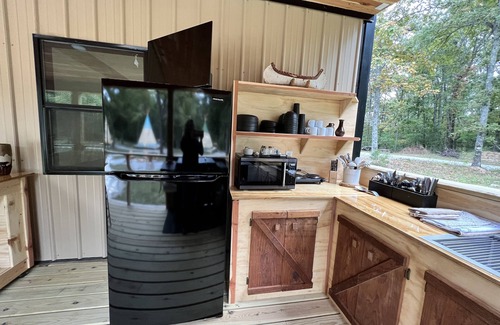 Newnata RV Rental | Glamping in an Authentic Style Sioux Tipi in the Heart of the Ozarks “The Bear”