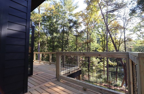 Roaring River Cabin | Gotham City Cabins!nSecluded “Custom Modern Cabin” overlooking Private Pond.