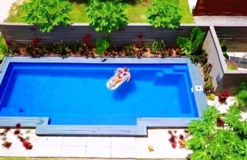 Muri Apartment | Great Value steps from Muri Beach with Kayaks, Paddle Boards, Pool, Free WIFI !