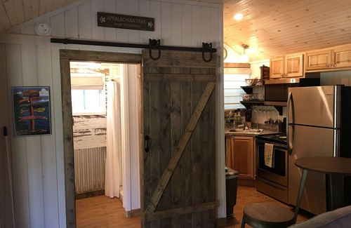 Tiger Cottage | Guest Cottage,Dog friendly, minutes to Clayton, fenced yard, hot tub on patio.