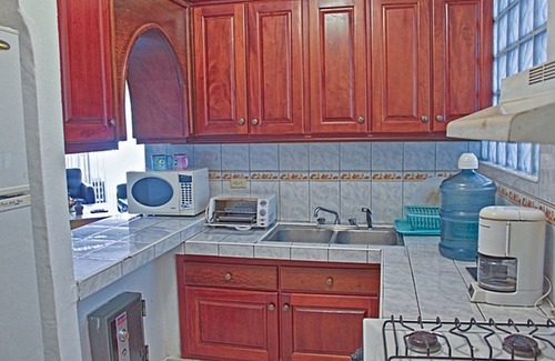 El Batey Apartment | Guest-friendly 2-BD central condo near beach, with pool, Wi-Fi, cable TV