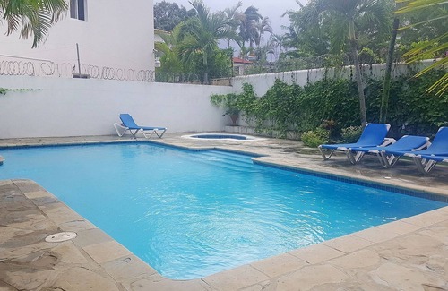 El Batey Apartment | Guest-friendly beachfront 3BD 3BTH apt, sea views, pool, near shops/restaurants