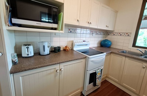 Kurrimine Beach Cottage | Gumnuts, A Coastal Bungalow, listen to the waves in Kurrimine Beach