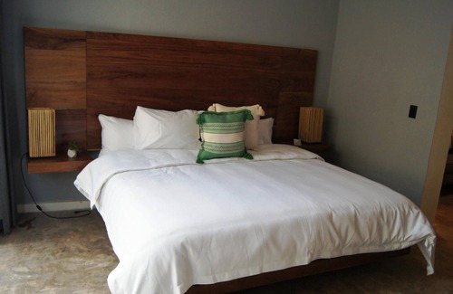 Barrio de Santiago Hotel | Habitación de lujo con king Size en el centro de Mérida.