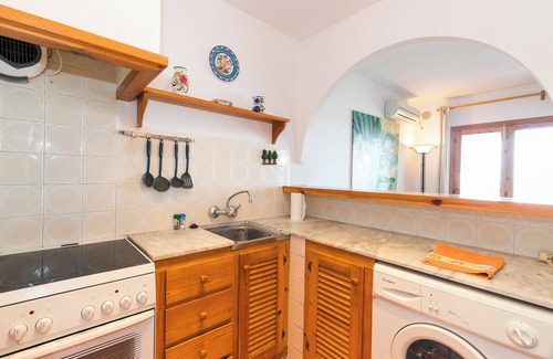 Arenal d'en Castell Apartment | Holiday Apartment “Apartamento en Arenal Castell” with Wi-Fi, A/C, Pool, Terrace & Garden