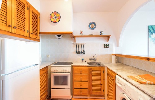 Arenal d'en Castell Apartment | Holiday Apartment “Apartamento en Arenal Castell” with Wi-Fi, A/C, Pool, Terrace & Garden