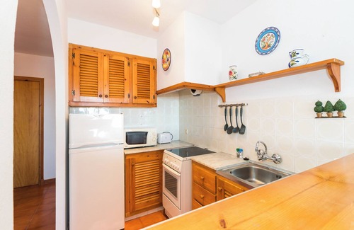 Arenal d'en Castell Apartment | Holiday Apartment “Apartamento en Arenal Castell” with Wi-Fi, A/C, Pool, Terrace & Garden