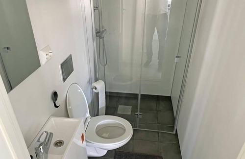 Vestbygd House | Holiday home 'Lista Maritim 2', built 2020, directly by the sea in Borhaug-Borshavn near Farsund on the Listafjorden, southern Norway, 6+3 persons, panoramic windows and terrace with spectacular sea views, modern furnishings, open plan living, 5 b.