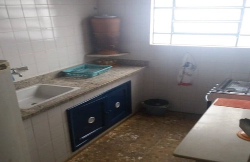 Balneario Remanso House | home Beach Center, wooded and grassy yard with fruit trees.