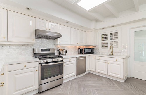 Central Beach House | Home Gem! Heated pool, lush backyard a block from the ocean on Central Beach!