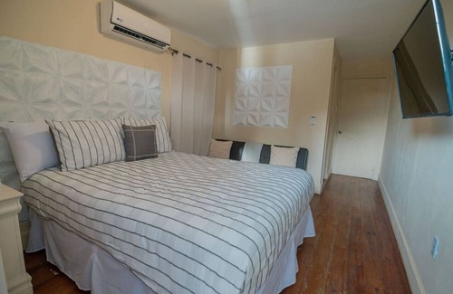 Antoneys Cay Apartment | Hotel room/in the heart of West End/Beach Front