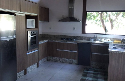 Rio Vermelho Sul House | House next to the woods, beach and lagoon.