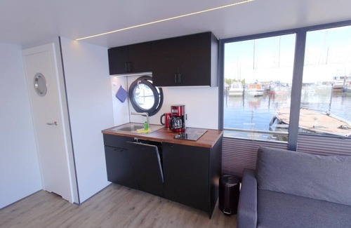 Schleswig Boat Rental | Houseboat Fjord Aries with roof terrace in Schleswig