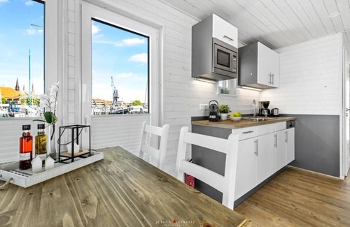 Schleswig Boat Rental | Houseboat moments of happiness for 4 people with roof terrace on the Baltic Sea fjord Schlei