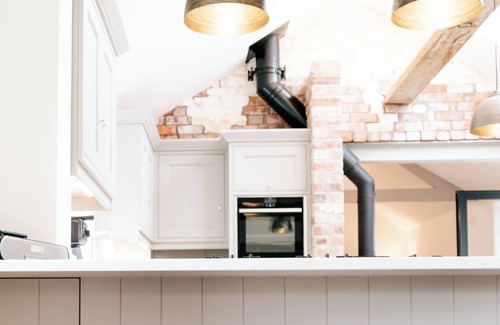 Nantwich House | Imagine relaxing on a spacious corner sofa, wrapped in the warmth of your loved ones, as the gentle crackle of a log burner fills the room. Picture yourself unwinding in a hot tub at sunset, drink in hand, with the stresses of the week melting away.