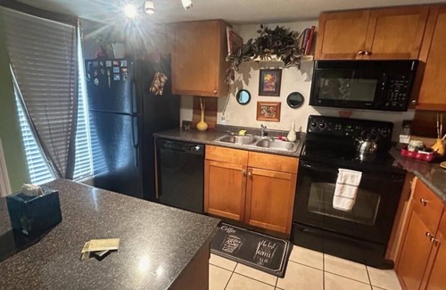 Gainesville Condo | King bed, pool, creek! Private artsy 1/1 condo in forest, 1.6 mi. north of UF!