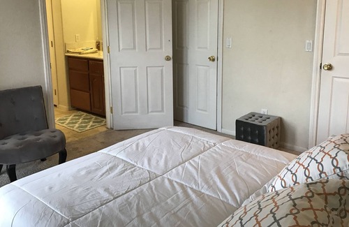 Hesperia House | Lake and mountain view bedroom in a custom home Hesperia