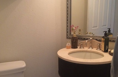 Hesperia House | Lake and mountain view bedroom in a custom home Hesperia