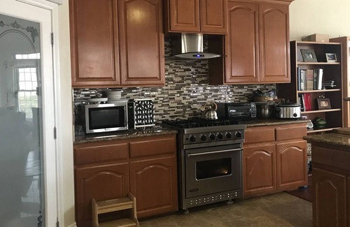 Hesperia House | Lake and mountain view bedroom in a custom home Hesperia