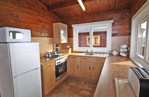 Pontardulais Cottage | Lake side log cabin peacefully situated and each enjoying fabulous lake views.