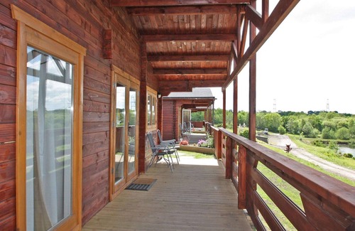 Pontardulais Cottage | Lake side log cabin peacefully situated and each enjoying fabulous lake views.