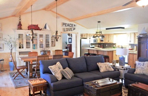 Mount Ida Cottage | Lake view three bedroom, three bath cottage with private hot tub overlooking Lake Ouachita. by RedAwning