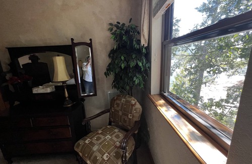 Mount Ida Cottage | Lake view two bedroom, two bath loft, log-sided cottage with private hot tub overlooking Lake Ouachita. by RedAwning