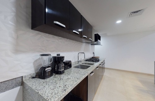 Downtown Cancun Apartment | Lakefront apartment with pool, fitness room, washer/dryer, & patio