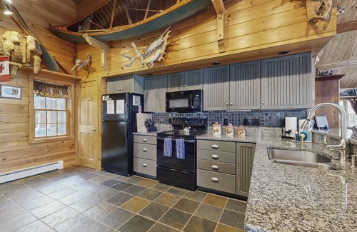 Greenville Junction House | Lakeside Lodge with Amazing Water Views, Screened Porch, Dock, & Firepit