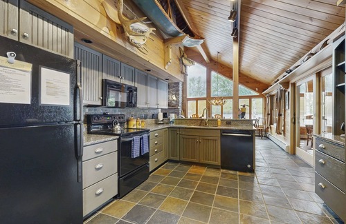 Greenville Junction House | Lakeside Lodge with Amazing Water Views, Screened Porch, Dock, & Firepit