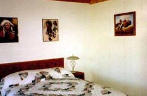 Big Timber House | Large log building in the country near a creek