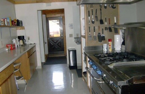 Big Timber House | Large log building in the country near a creek