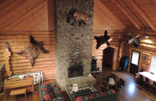 Big Timber House | Large log building in the country near a creek