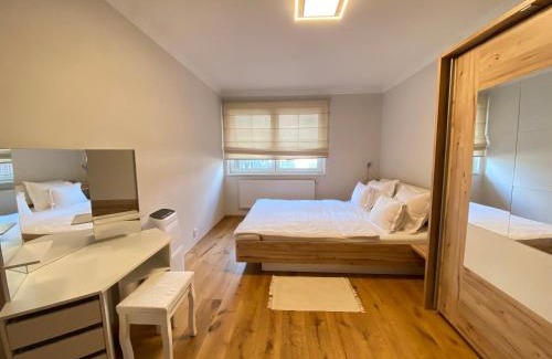 Hlubocepy Apartment | Light & Wood Design - 89 m2 Apartment in Prague