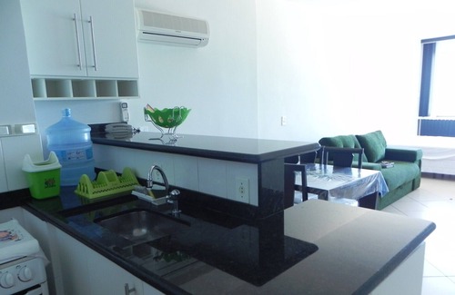 Prainha Apartment | LOFT facing the beach. Swimming pool, sauna, Wi-Fi/garage, all included.