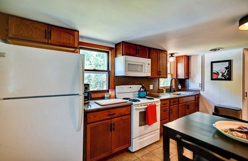 Verona Apartment | Look out at the treetops at the cozy Paoli Nest. Near Epic Systems and Madison.