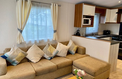 Hamworthy House | Lotus 2 bedroom dog friendly caravan with veranda offers a stunning sea view.