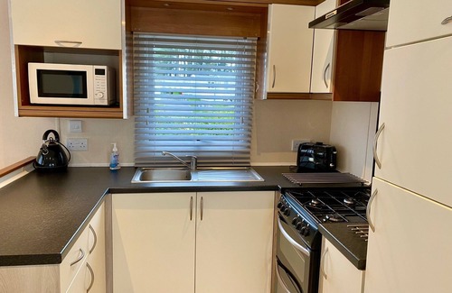 Hamworthy House | Lotus 2 bedroom dog friendly caravan with veranda offers a stunning sea view.