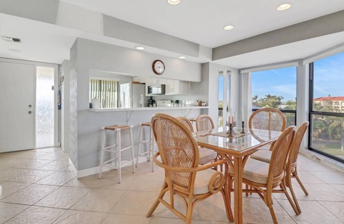 Mid Island Condo | Lovely End-Unit, Lagoon-Front Community, South of Mid-Island! Heated Community Pool! Free Parking!