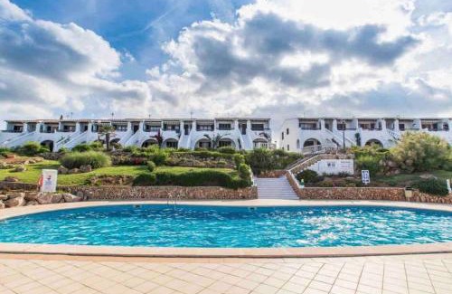 Arenal d'en Castell Apartment | Lovely hideaway with pool and white sand beach