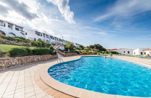 Arenal d'en Castell Apartment | Lovely hideaway with pool and white sand beach