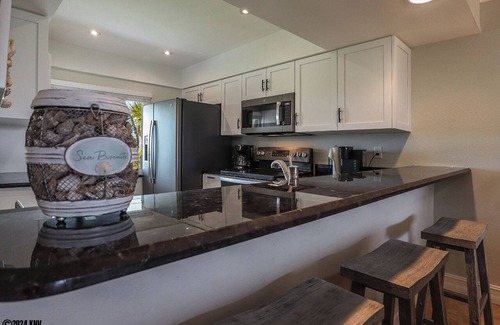 Mid Island Condo | LOVELY WATERFRONT BAY VILLAGE 2B/2B CONDO! WALK TO BEACH!