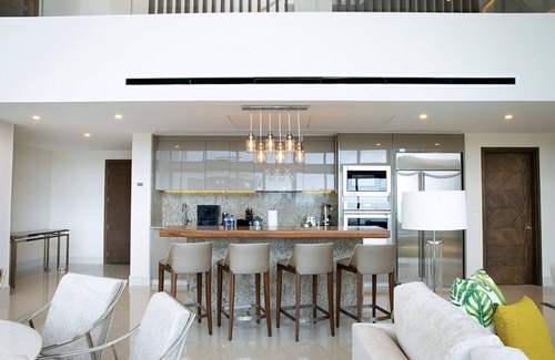 Puerto Juarez Resort | Luxurious 4 Bedroom Penthouse Loft right on the beach of Cancun!