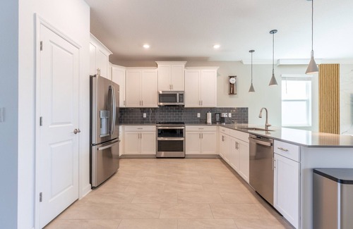 Kissimmee House | Luxury Lakeview Villa with Game Room + Theater & Free Waterpark Close to Disney