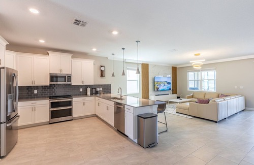 Kissimmee House | Luxury Lakeview Villa with Game Room + Theater & Free Waterpark Close to Disney
