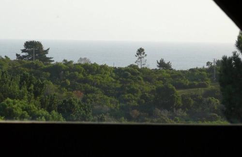 Wilderness House | Luxury log home with lake and mountain views, close to world-class golf courses