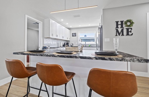 Orchid Lake Village House | Luxury Pool Home! Heated Pool, Fire Pit, Fishing Dock & More – Relaxation & Fun Await!