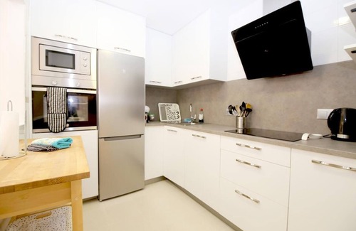 Estepona Apartment | Modern and bright apartment with communal pool, Estepona port near restaurants, bars and beaches