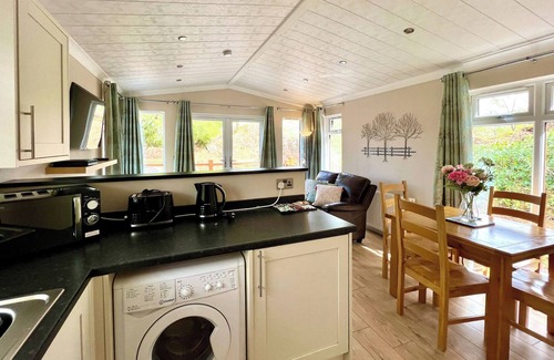 Broughton Mills House | Modern and contemporary lodge style holiday home set in woodland area.