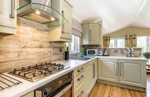 Broughton Mills House | Modern and contemporary lodge style holiday home set in woodland area.